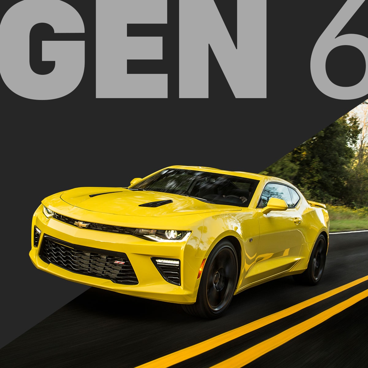 Front Angle View of a Bright Yellow Chevy Camaro Convertible Driving at Night