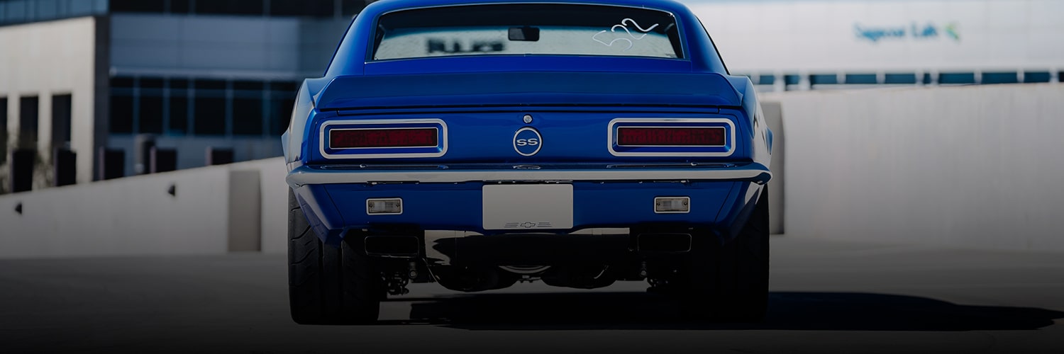 Rear View of a Bright Blue Classic Chevy Camaro Ss Parked on a Pavement