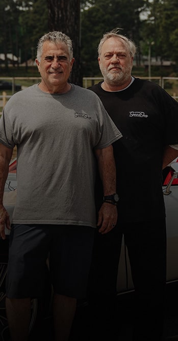 Two People Standing Outdoors With Trees in the Background and White Text Overlay Reading “Ever Since I Was Old Enough to Walk, I’ve Loved Cars.” With the Name Don Milligan and “1969 Corvette” Below.