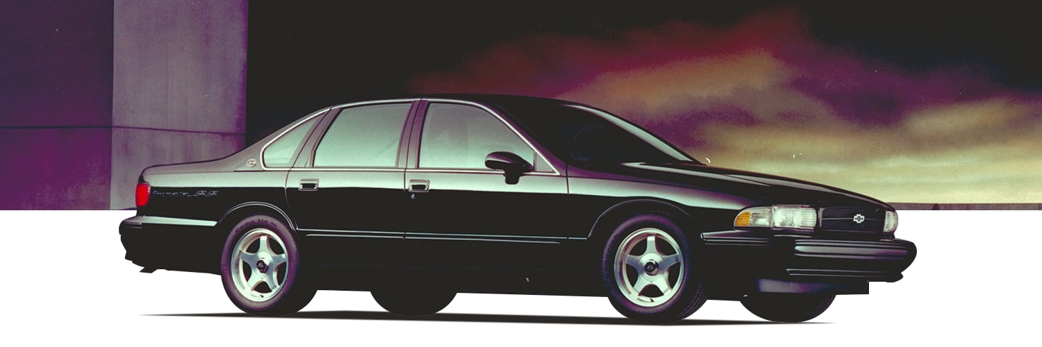 Black Chevrolet Vehicle Side Profile Parked on a White Plain with a Dramatic Sunset Sky