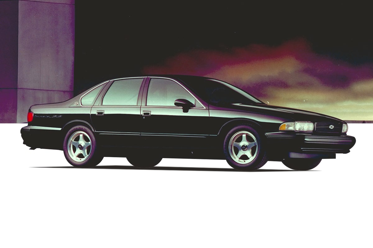 Black Chevrolet Vehicle Side Profile Parked on a White Plain with a Dramatic Sunset Sky