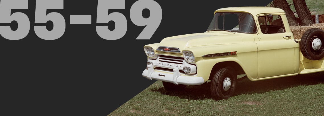 Side View of a Vintage Yellow Chevrolet Pickup Truck Hauling Bales of Hay