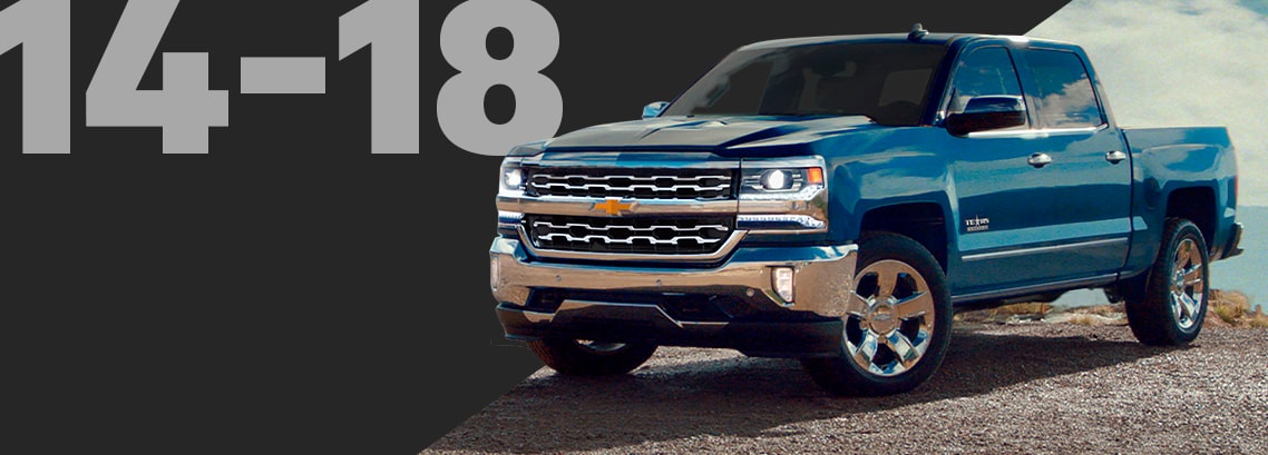 Three-quarter View of a Blue Chevrolet Pickup Truck on a Rocky Overlook