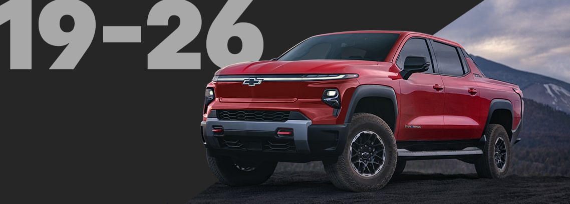 Bold Red Silverado Pickup Truck Parked on a Dark Mountain Overlook