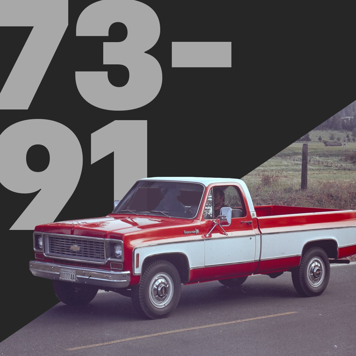 Red and White Classic Chevrolet Pickup Truck Driving on a Rural Road