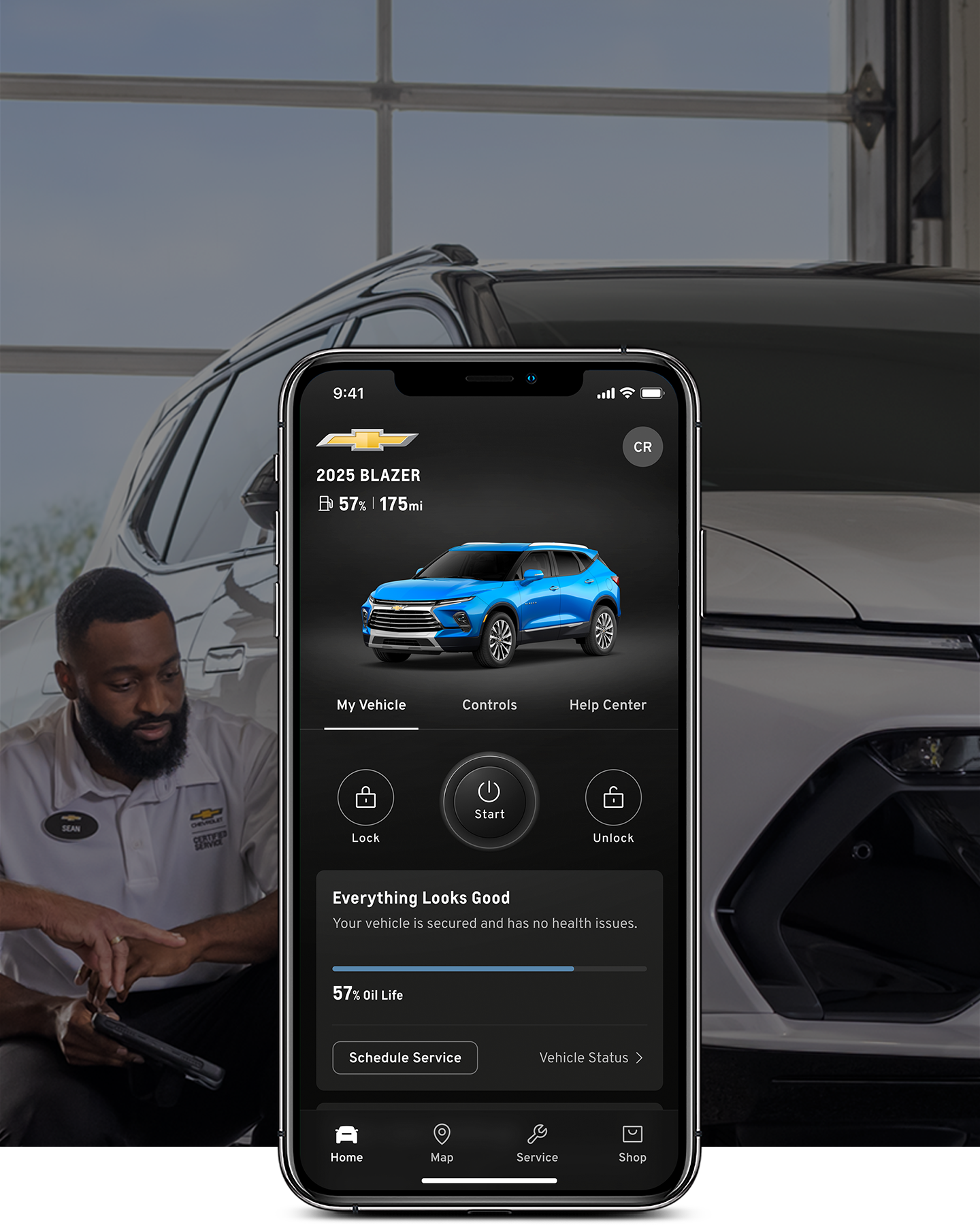 Family Sitting Beside Parked Black Chevrolet SUV under Covered Structure
