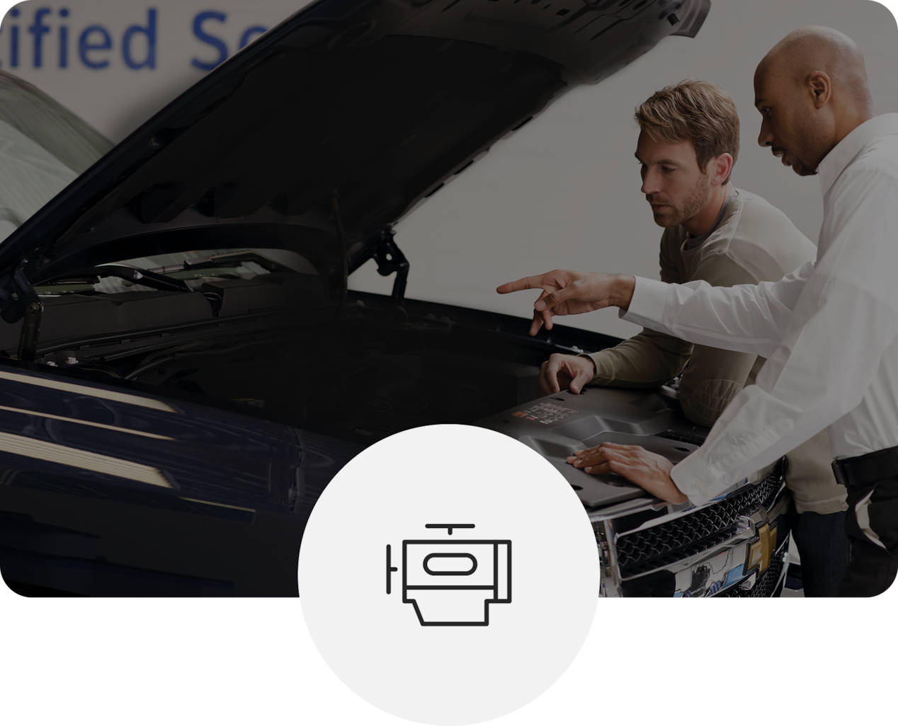 Two Technicians Inspecting Under Hood of Vehicle