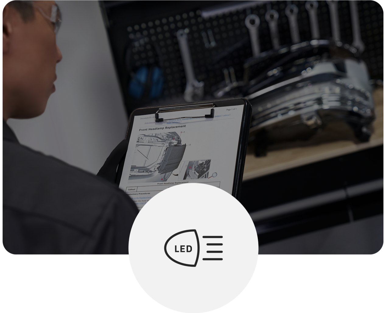 Technician Looking at Paperwork While Inspecting Component on Table