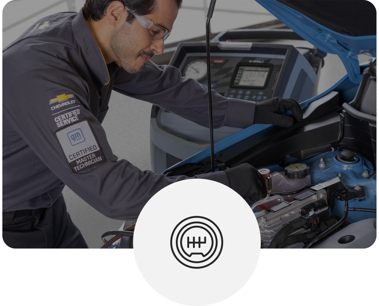 Technician Working Under Hood of Blue Chevy Vehicle