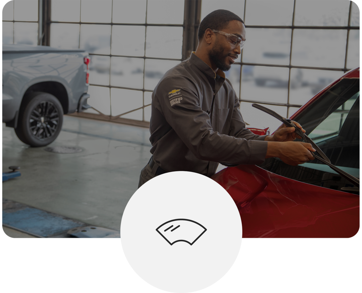 Technician Installing Windshield on Red Vehicle