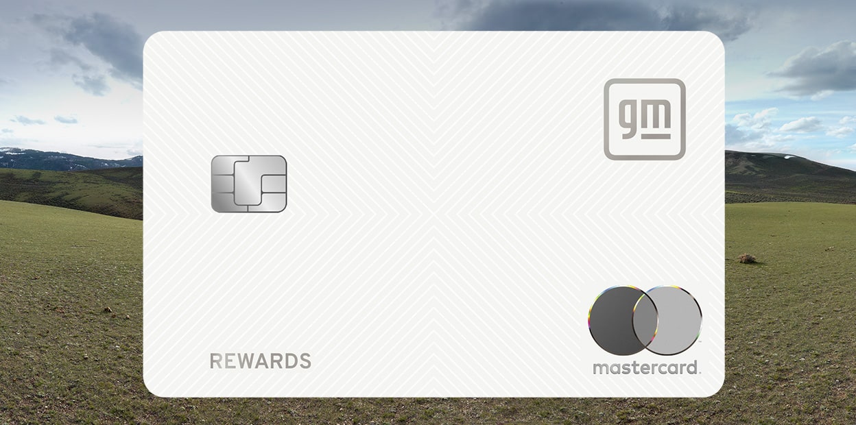 Wide Landscape View of Open Grassy Field Beneath Cloudy Sky with Close-Up of GM Rewards Mastercard and Blue Rectangle