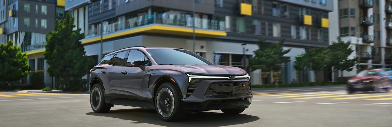 A Chevy EV Car Drives Through the City