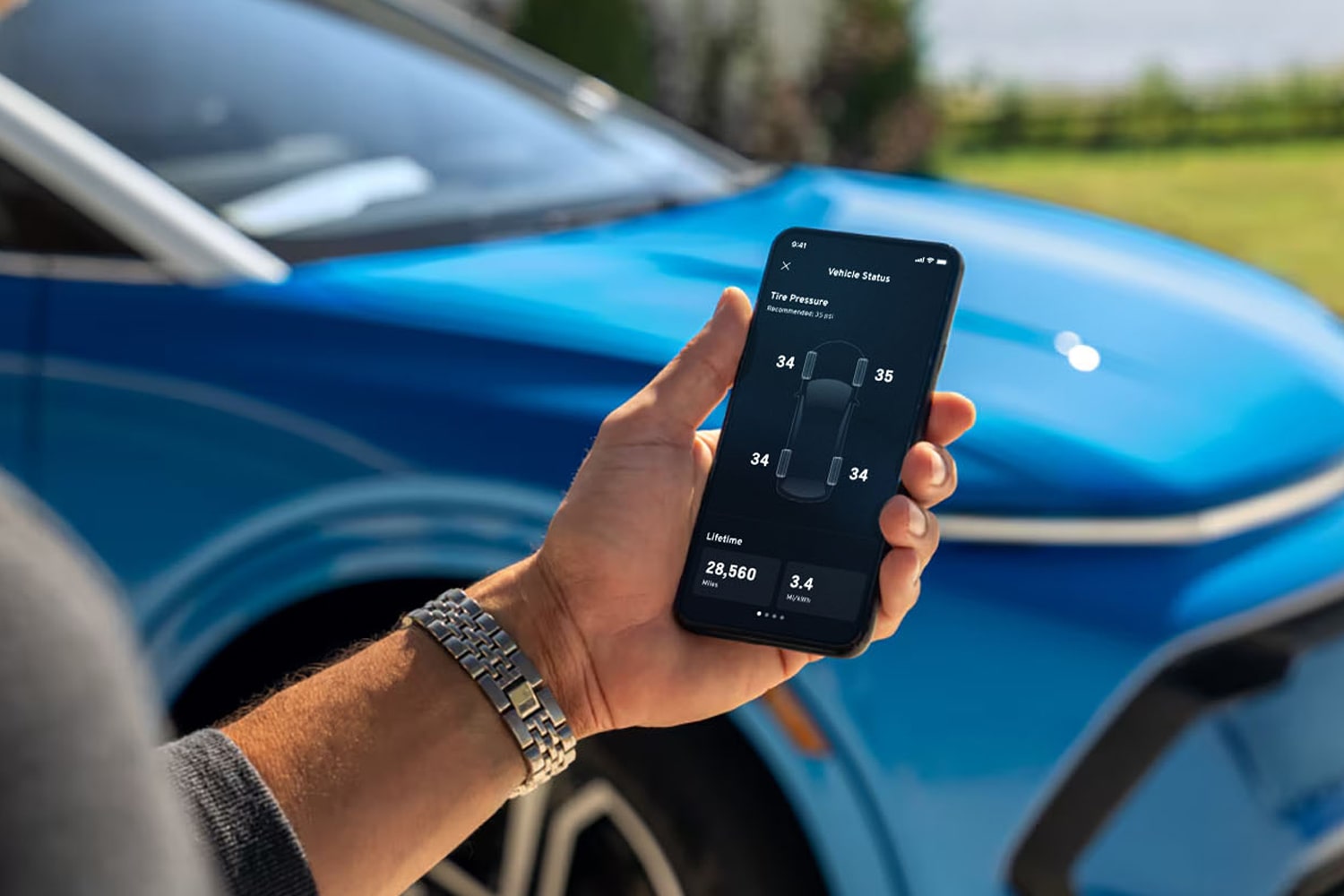 Person using Mychevrolet Mobile App