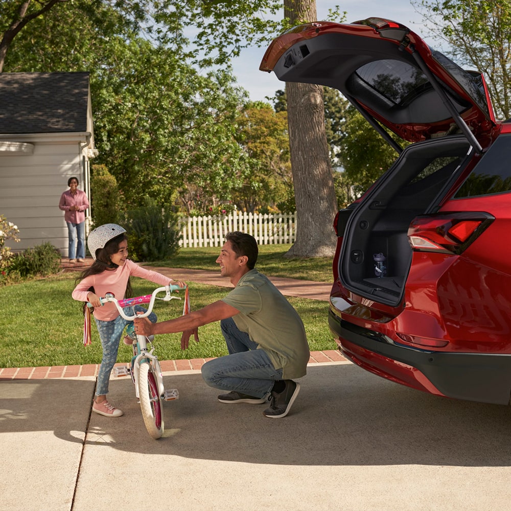 Person unloading Bike from SUV 