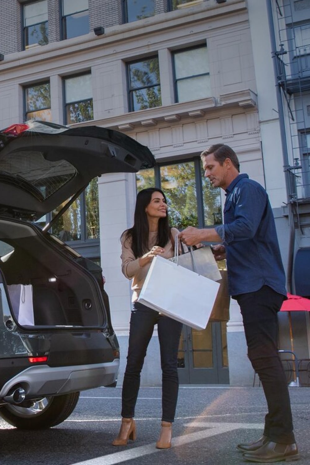 Couple Loading Trunk of SUV