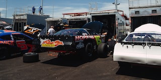 Vehicles Lined Up to Be Loaded Up into Storage Containers