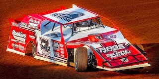 Red Racing Vehicle on the Speedway Track