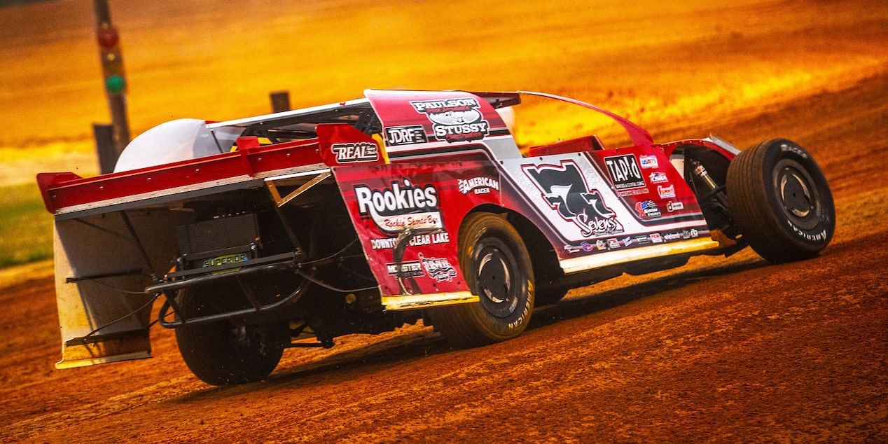 Left Rear View of a Race Car on a Dirt Track