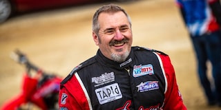 Race Car Driver Smiling in his Race Suit