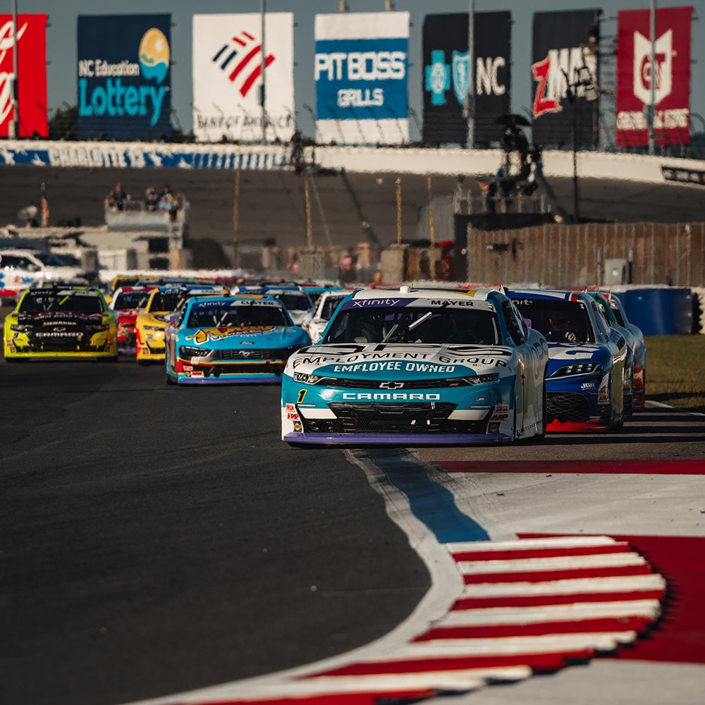 Front View of Race Cars on a Track