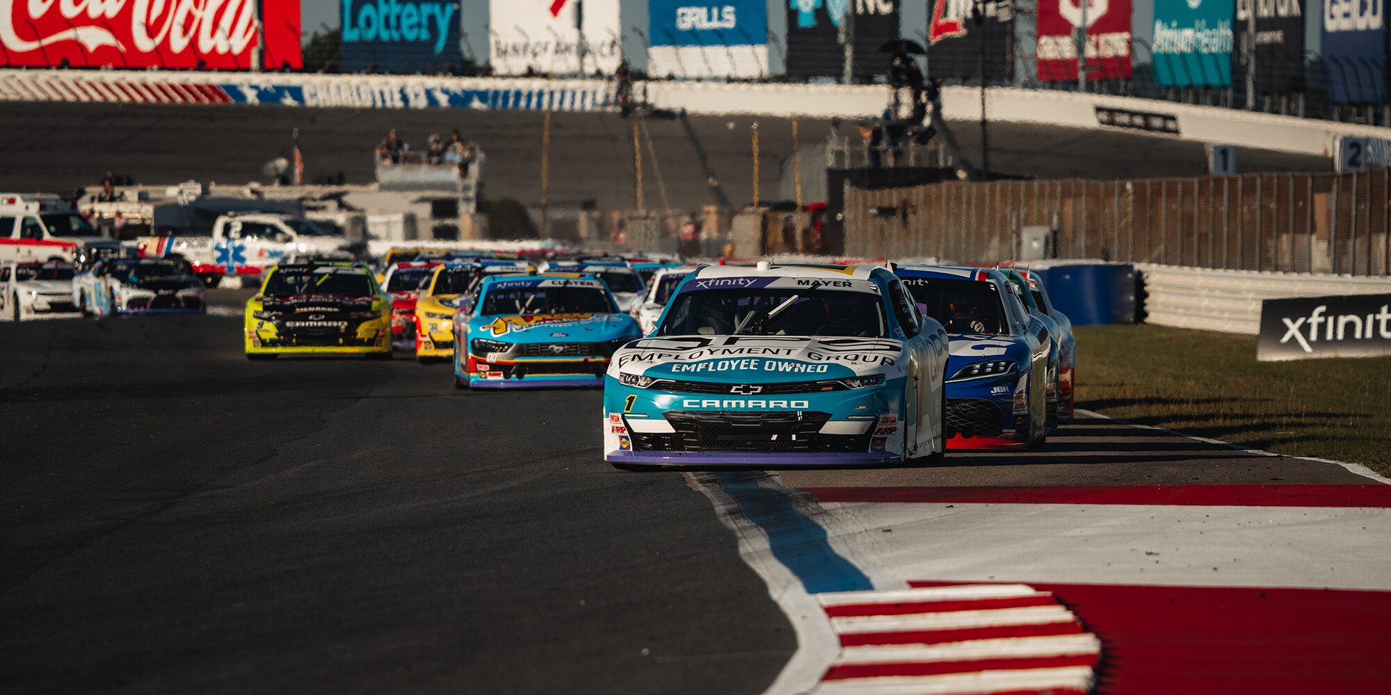 Front View of Race Cars on a Track