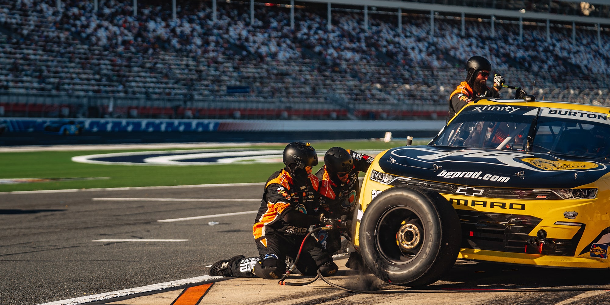 Two Crew Members Working on a Camaro Race Car
