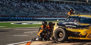 Two Crew Members Working on a Camaro Race Car