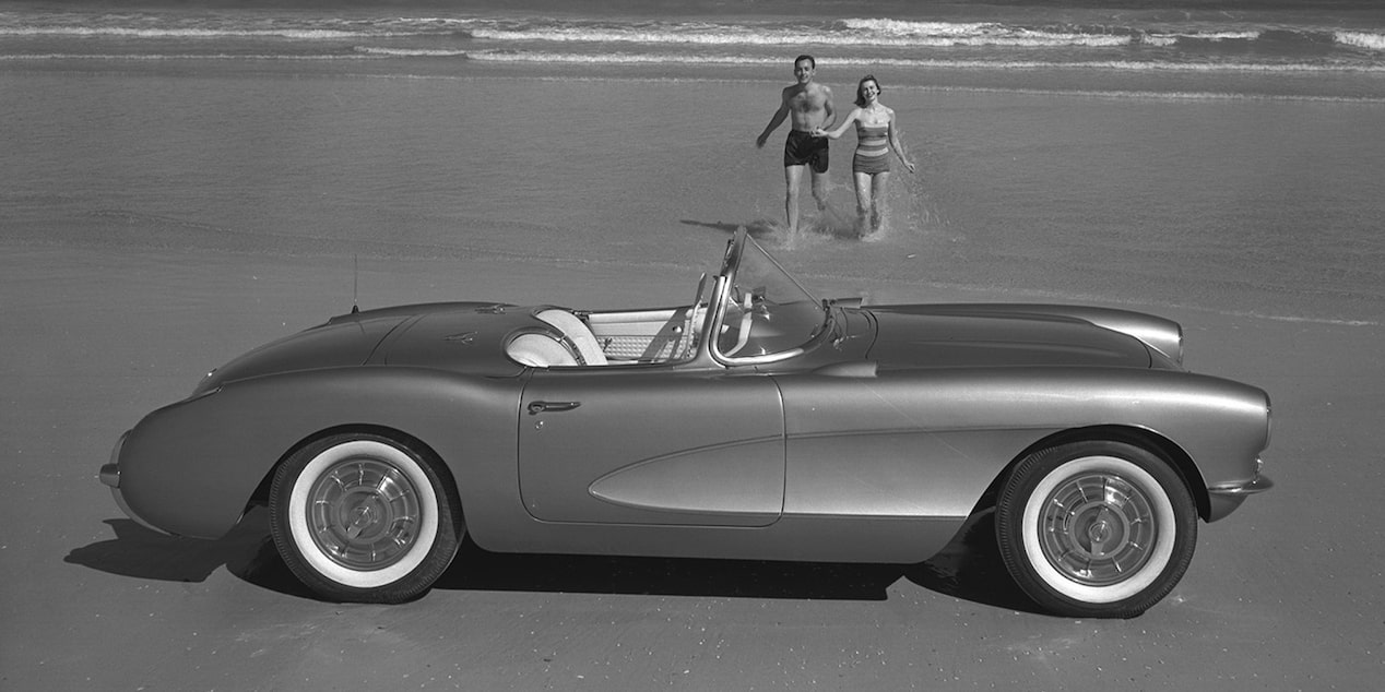 Black and White Photo with a Side View of a 1957 Chevy Corvette Convertible on the Beach