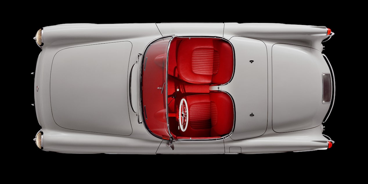 Overhead View of a White 1962 Chevy Corvette Convertible with the Top Down and Red Trim on the Seats