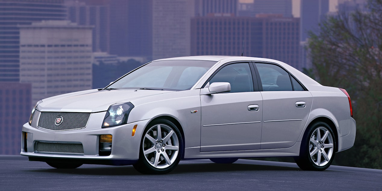 A White 2004 Cadillac CTS V Parked with a Cityscape in the Background
