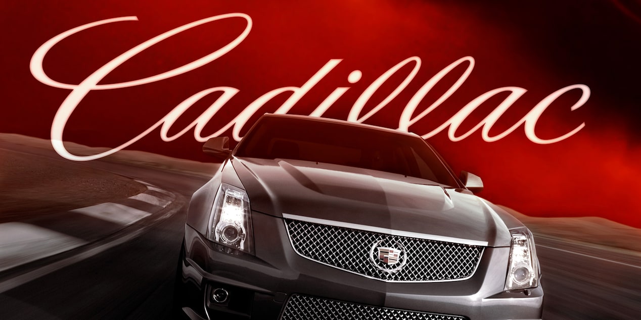 A 2009 Cadillac CTS V Driving Forward with "Cadillac" Lettering Stylized Behind It and Billowing Red Smoke in Its Wake