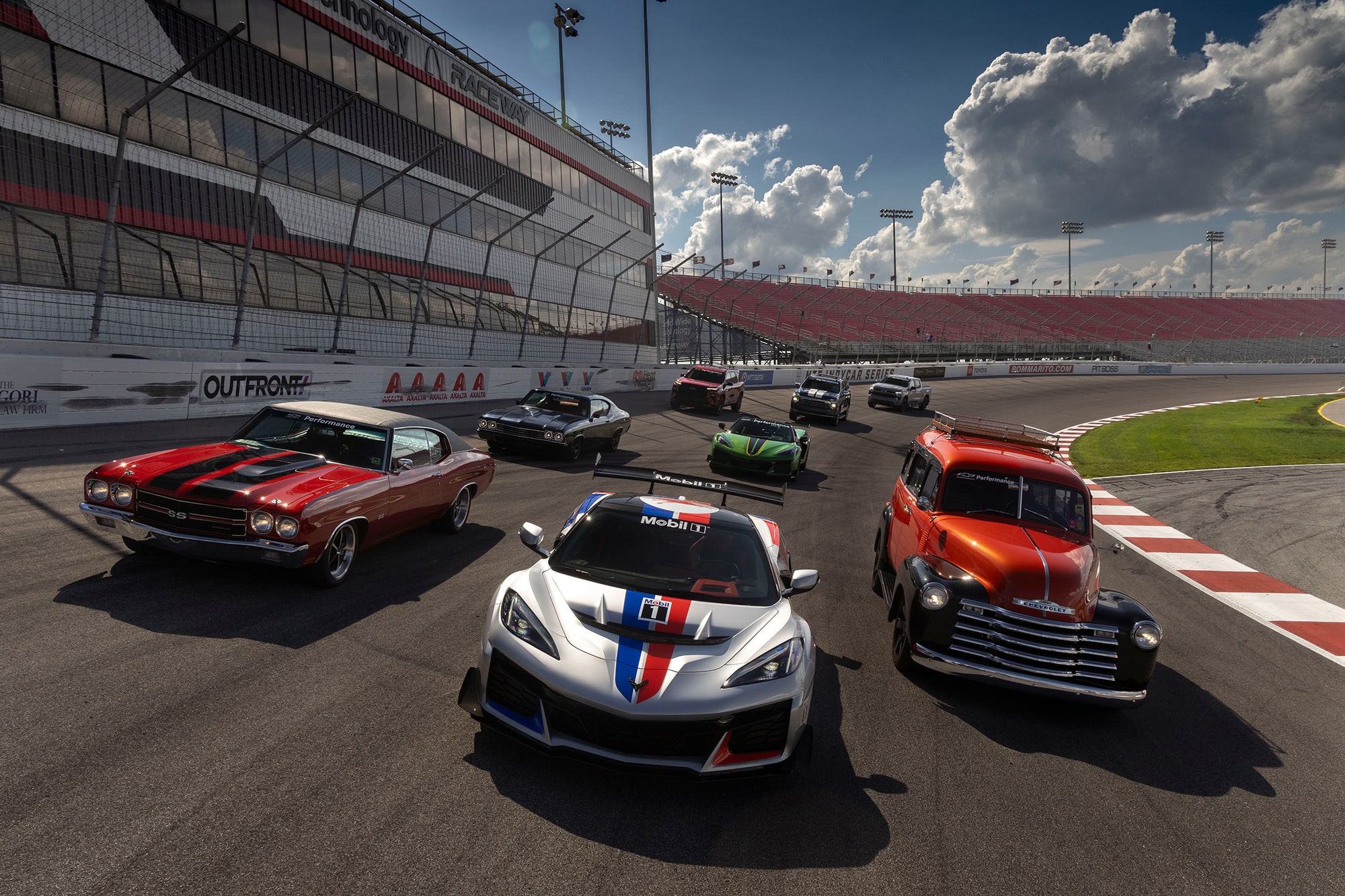 Front View of Chevrolet Sport Cars Racing on Track