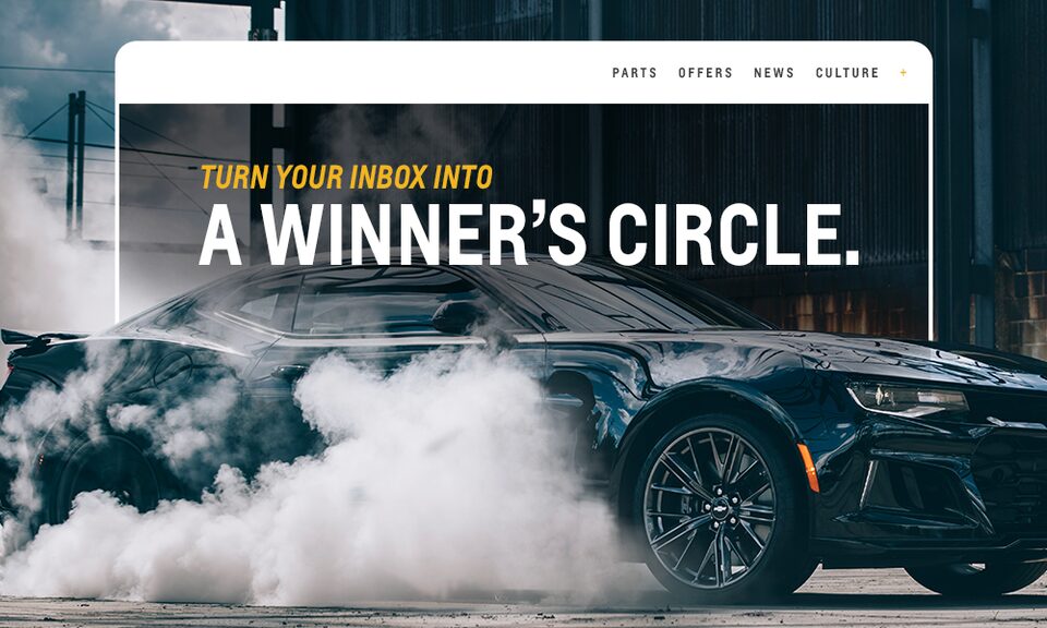 A Chevrolet Camaro Surrounded by Smoke with Text Overlay “Turn Your Inbox Into a Winner’s Circle”