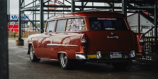 Left Rear View of an Autumn Bronze 1955 210 Handman Wagon
