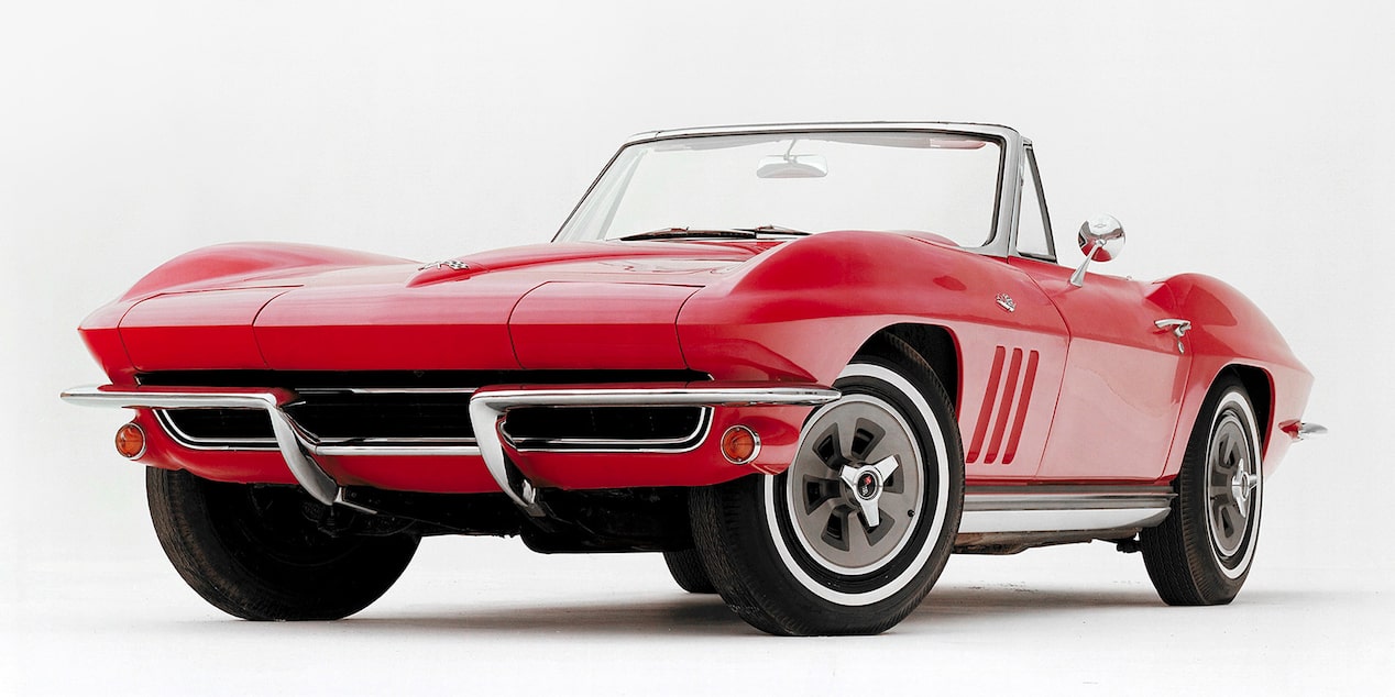 Front Three Quarters View of a Red 1965 Chevy Stingray Against a White Background