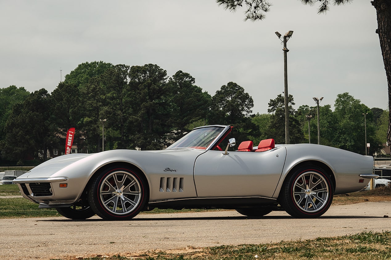 Left Side View of a Silver 1969 Chevy Corvette Convertible in a Parking Lot
