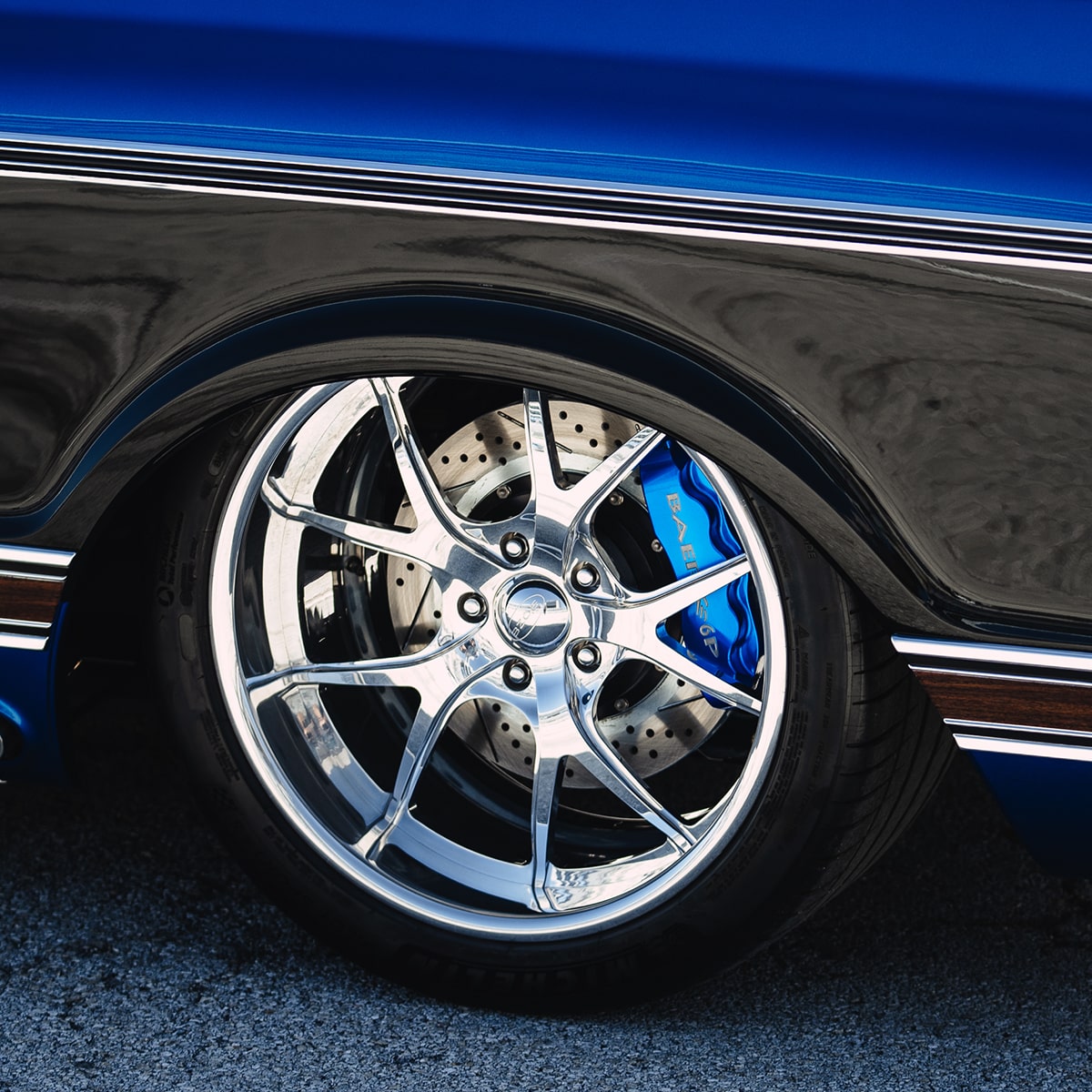 Close-up of the Tire of a Black and Blue 1972 Chevy Bruzer Pickup Truck