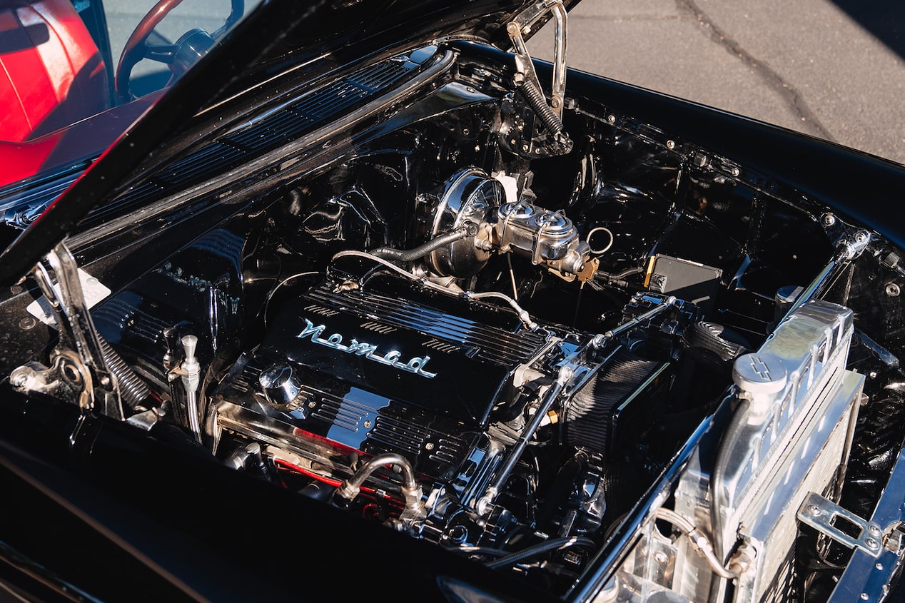 A Chevrolet Performance Parts LT1 Crate Engine in the Engine Bay of a Black 1955 Chevy Bel Air