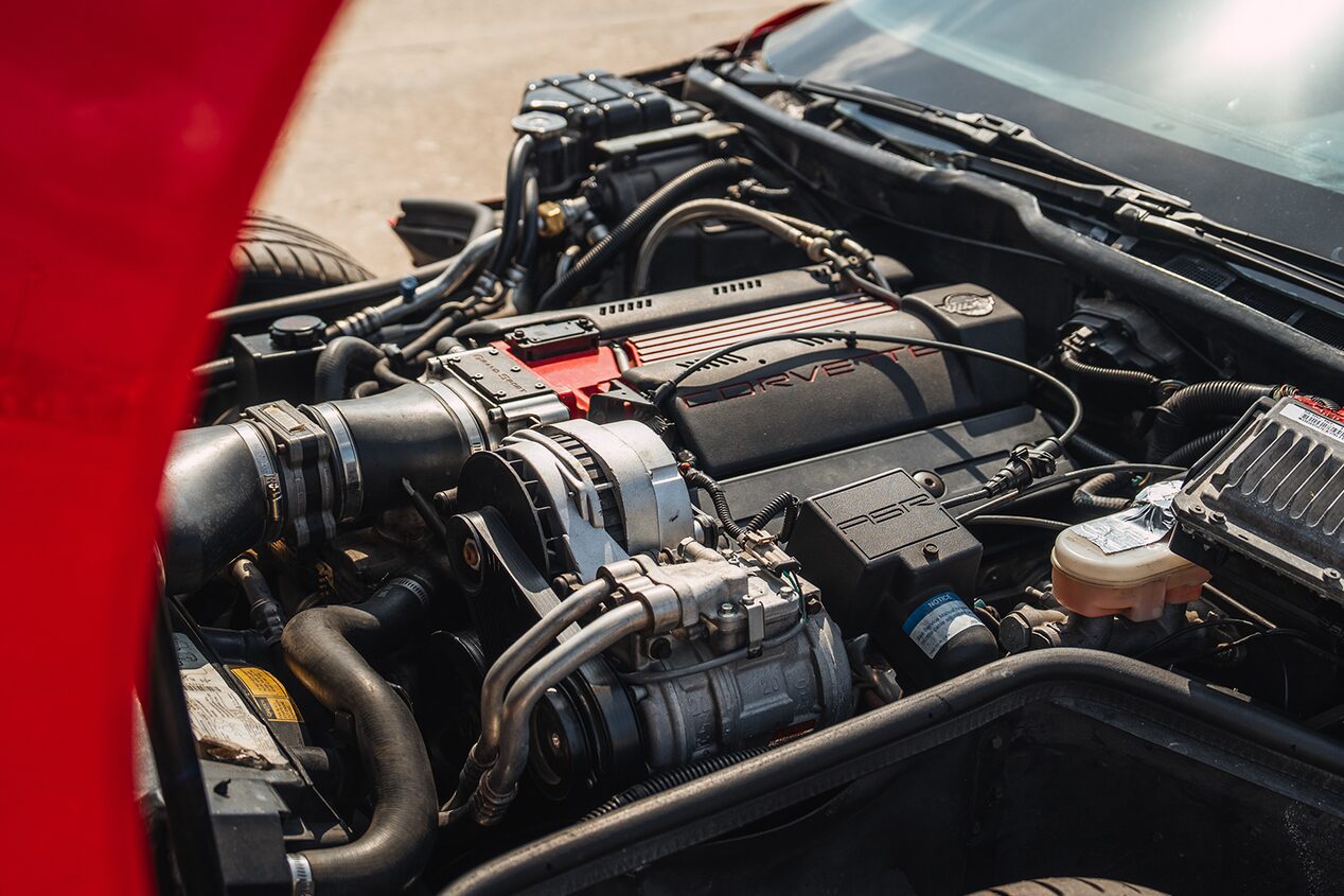 A Chevrolet Performance Parts LT4 Crate Engine in the Engine Bay of a Red 1996 Chevy Corvette
