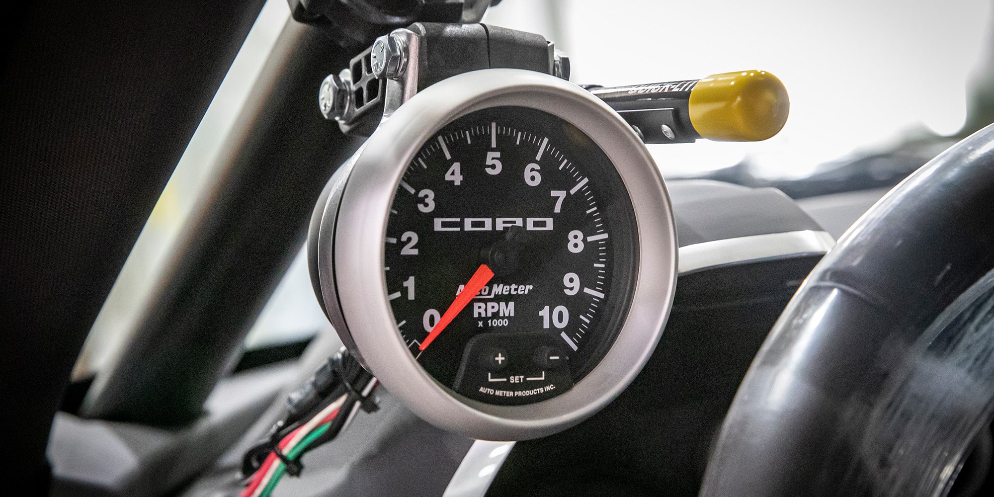 A Close-Up of a Tachometer in a COPO Camaro
