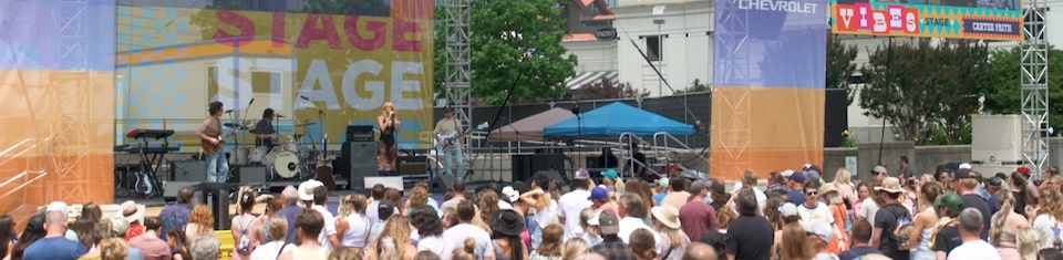Crowd watching musician at 2023 CMA Fest