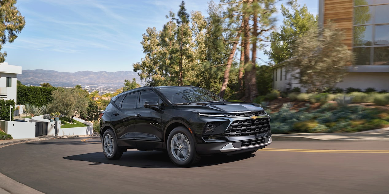 A Black 2026 Chevy Blazer Parked Next to a Building on a Sunny Day