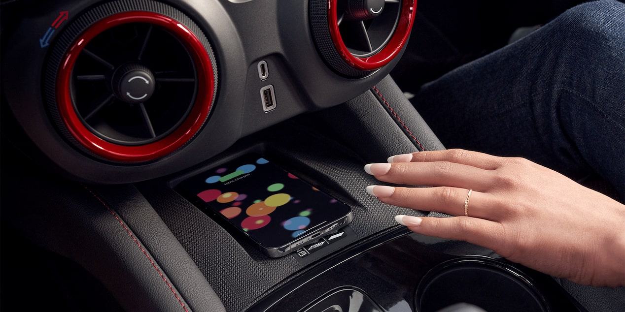 Woman Using Wireless Smart Phone Charging Inside the 2026 Chevy Blazer
