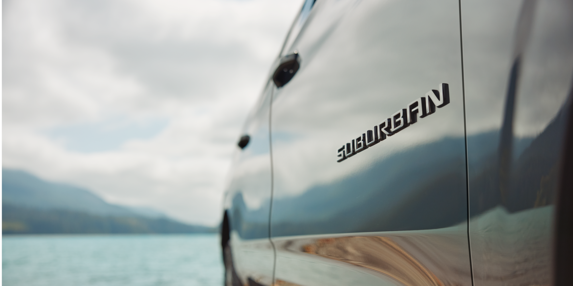 Close-up of the Suburban Nameplate on the Exterior Near the Lake