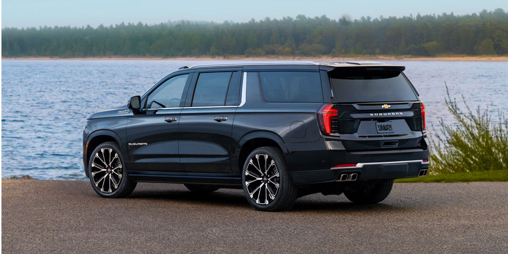 Rear Three-quarters View of the 2026 Chevy Suburban Parked Near the Lake