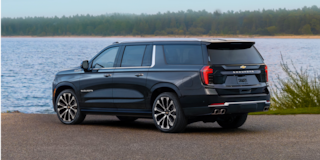 Rear Three-quarters View of the 2026 Chevy Suburban Parked Near the Lake