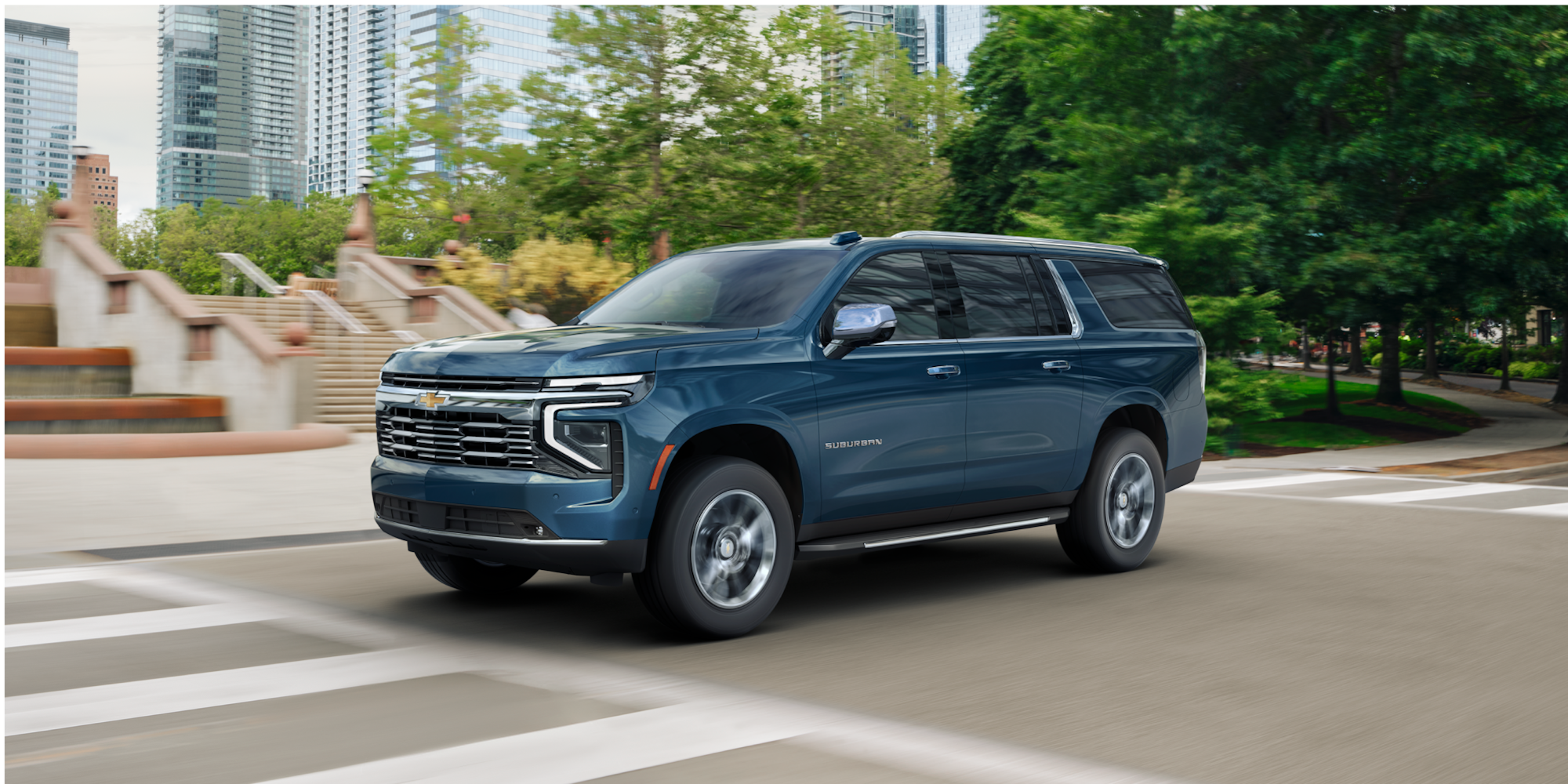 Three-quarters View of the 2026 Chevy Suburban SUV Driving Through the City