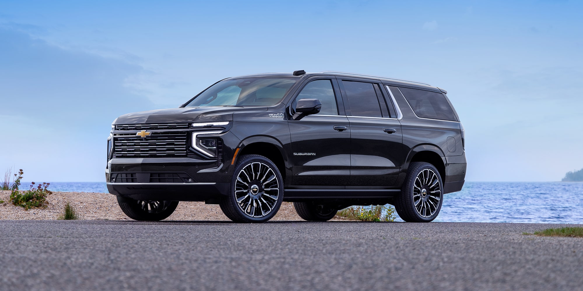 Front Three-quarters View of the 2026 Chevy Suburban Parked Near the Lake