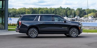 Profile View of the 2026 Chevrolet Suburban SUV Passenger Side Parked Near a Boating Dock