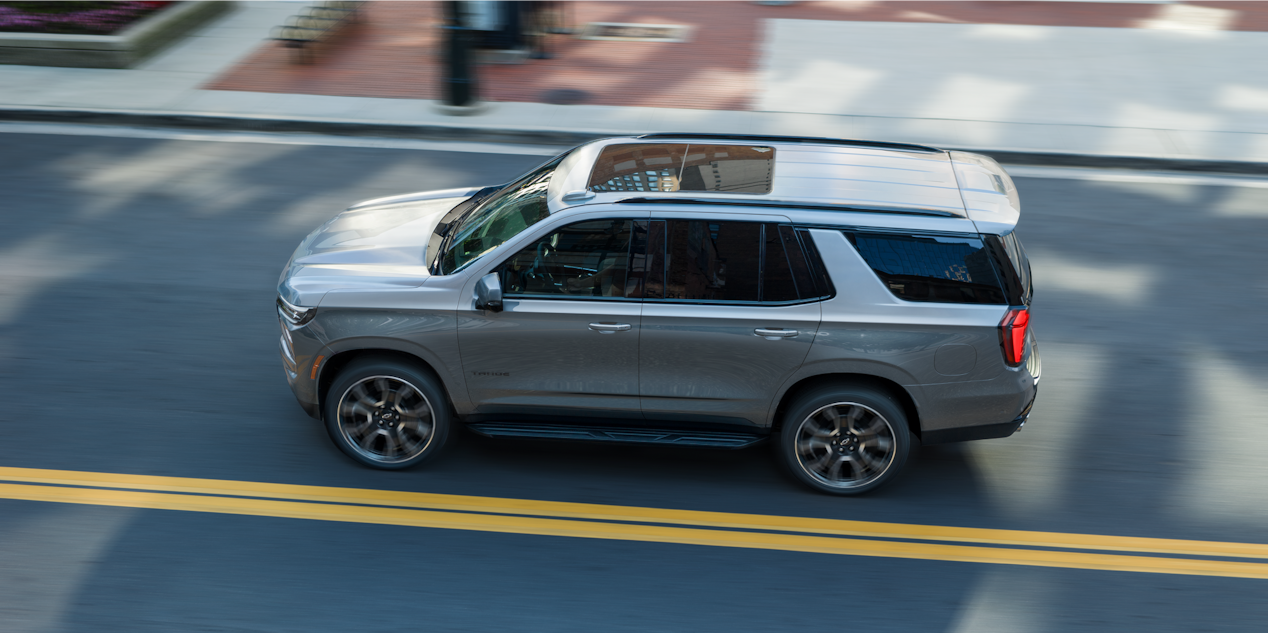 Bird's-eye View of the 2026 Chevy Tahoe Driving Down a Road